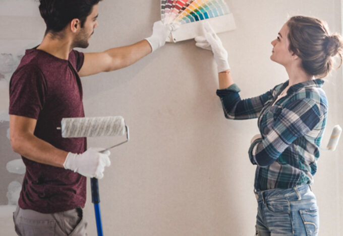 A couple choses paint colors for renovating their home