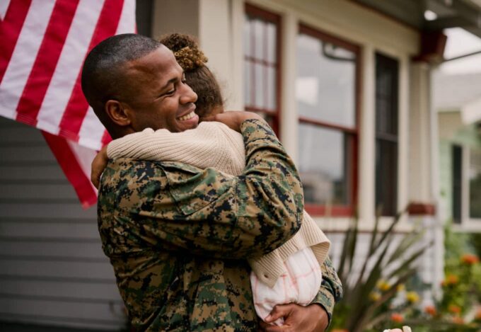 Military member coming home to his family in his VA loan funded home
