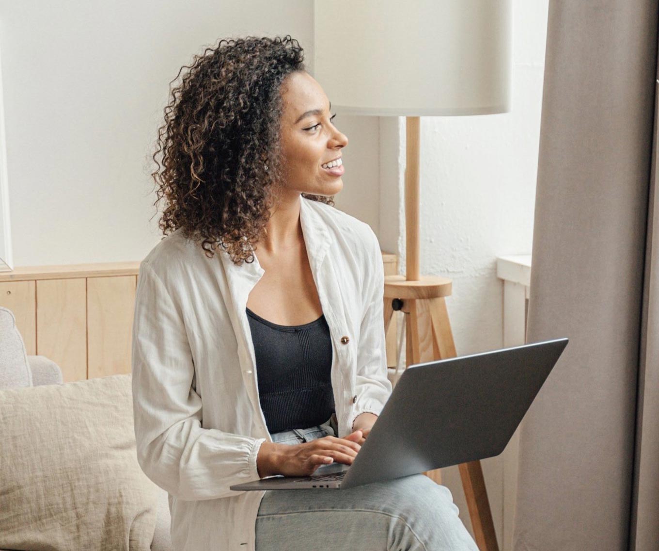 A woman researching mortgage rates on her laptop.