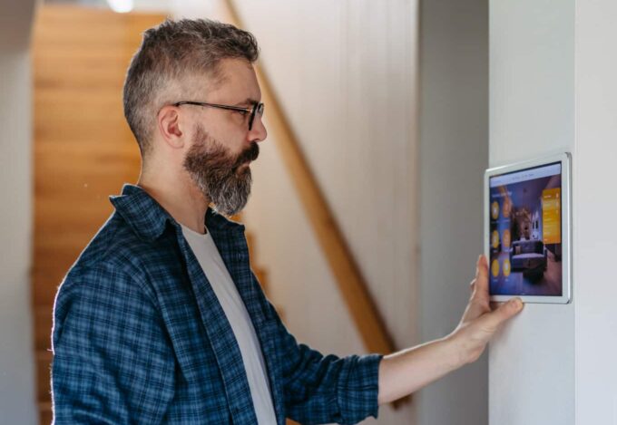 Homeowner turning on their security system