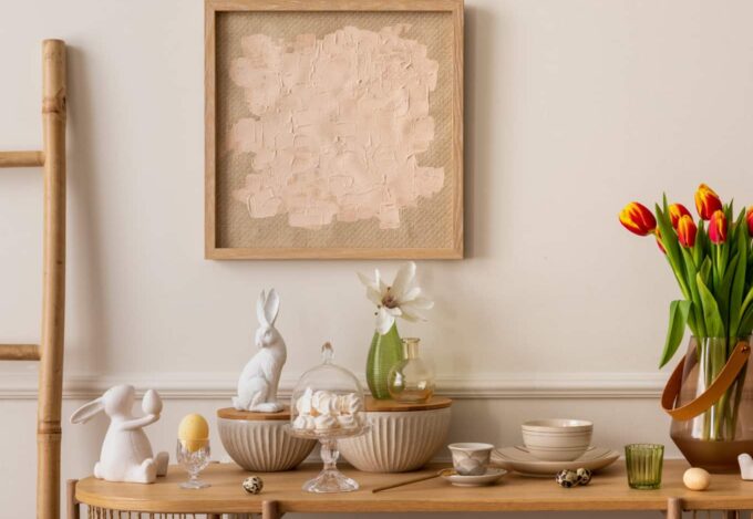 Table with spring decor, including tulips, rabbits and pale colors.