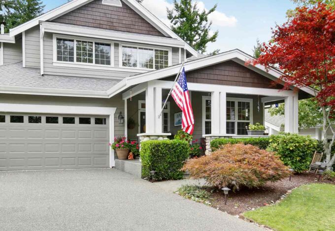 Exterior of a home that qualified for a VA loan displays the American flag.