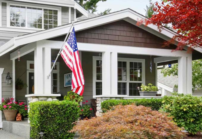 Bungalow house with an American flag.